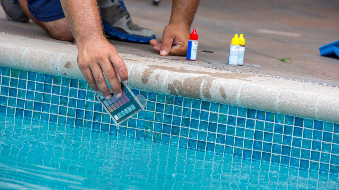 Pool professional checking water chemistry
